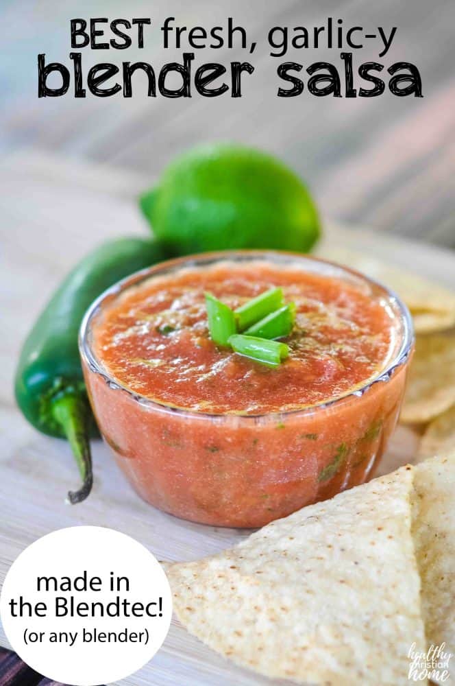 Garlic blender salsa in a small clear ramekin surrounded by tortilla chips.