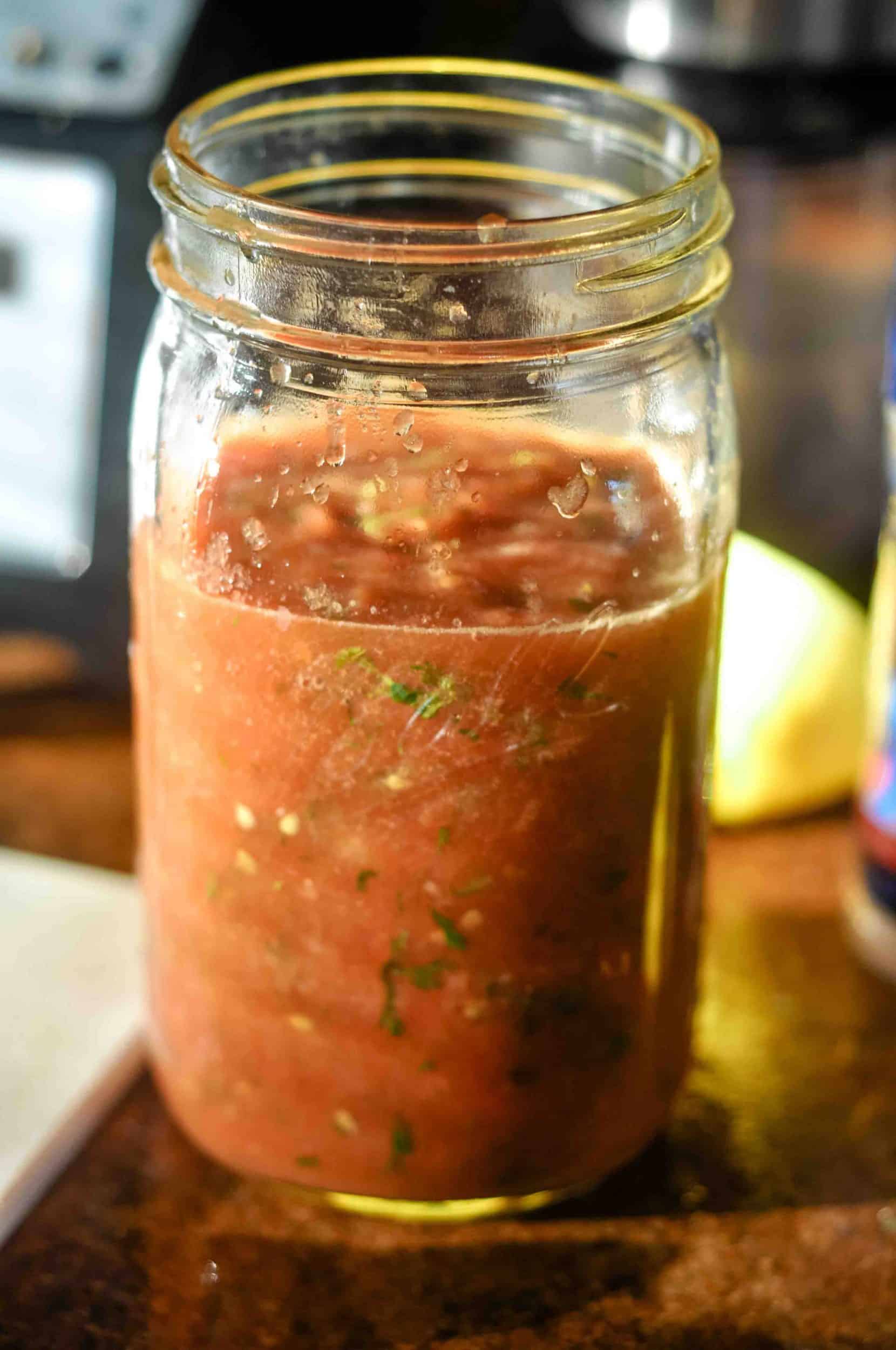 Jar of homemade salsa. A Traditional Diet advocates the use of homemade condiments and less processed foods.