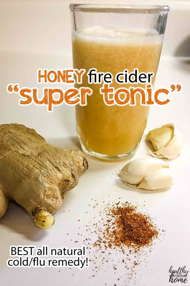 honey fire cider super tonic in a small glass