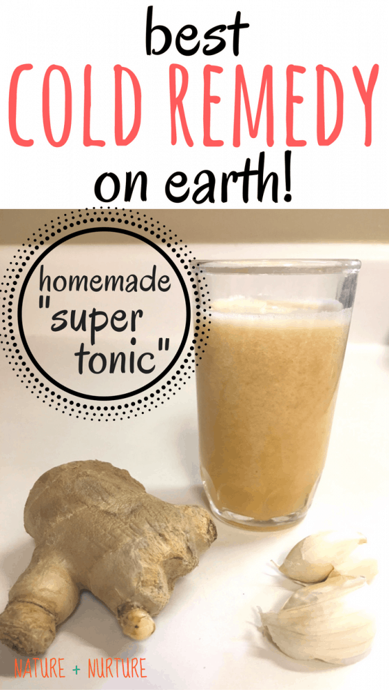 Super tonic cold remedy in a small glass, pictured with ginger, garlic and cayenne pepper. Text overlay says, "Best Cold Remedy on Earth!"