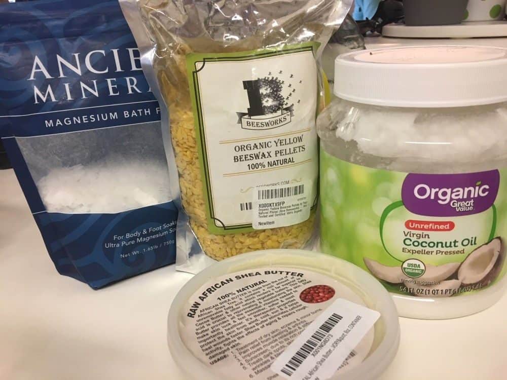 Magnesium lotion recipe ingredients grouped together: magnesium flakes, beeswax pellets, coconut oil, and shea butter.