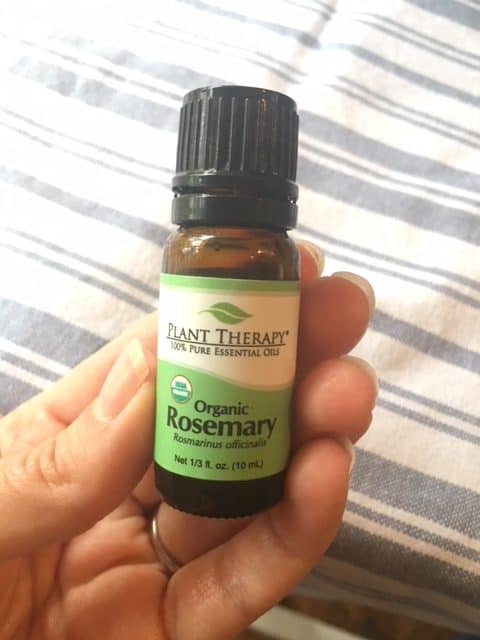 A bottle of rosemary essential oils.