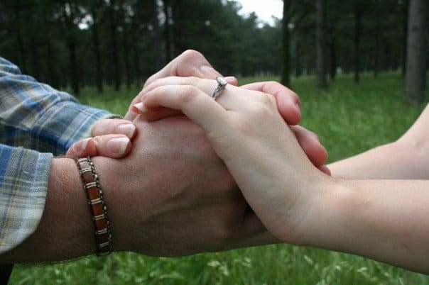 A couple holding hands.