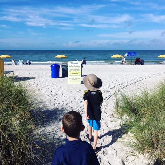 Kids walking to the ocean to swim - vacation activities for kids