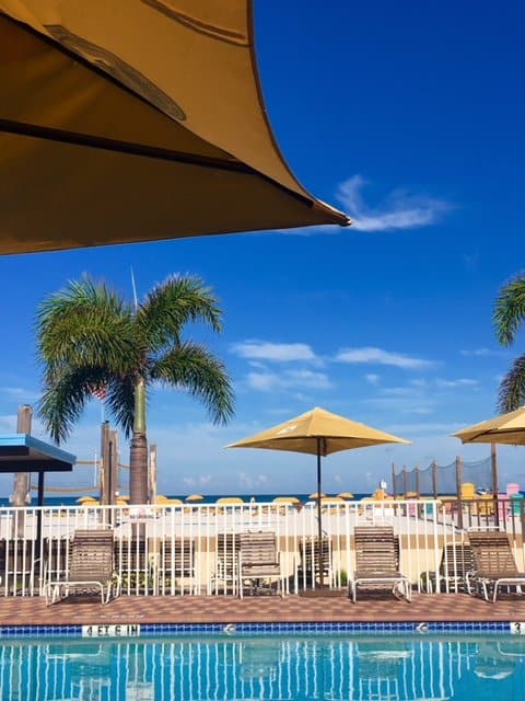 Under the umbrella at the pool overlooking St. Pete beach.