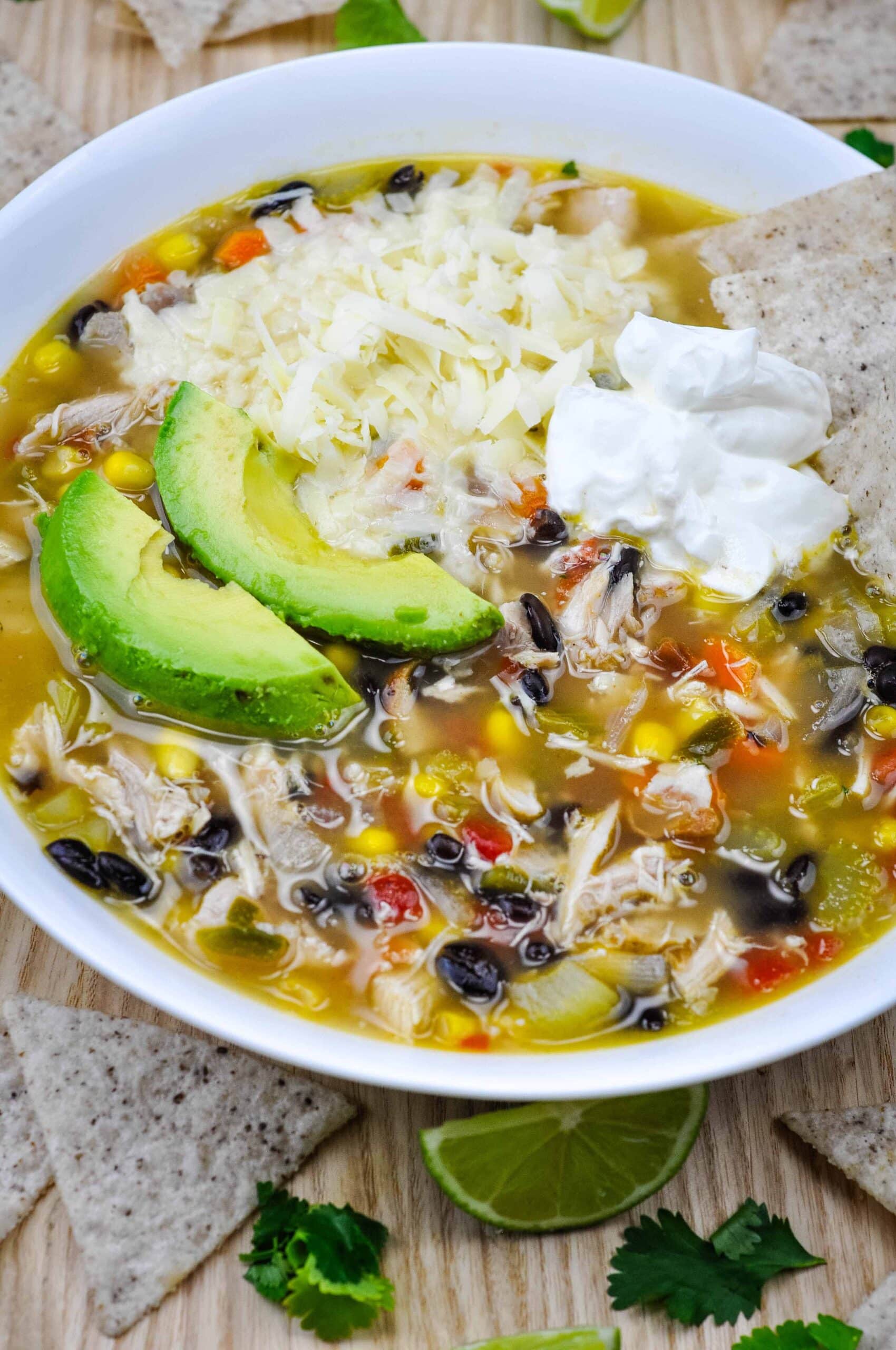 Chuy's tortilla soup copycat recipe in a large bowl with toppings.