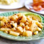 Simple home pan fried potatoes in a small dish.