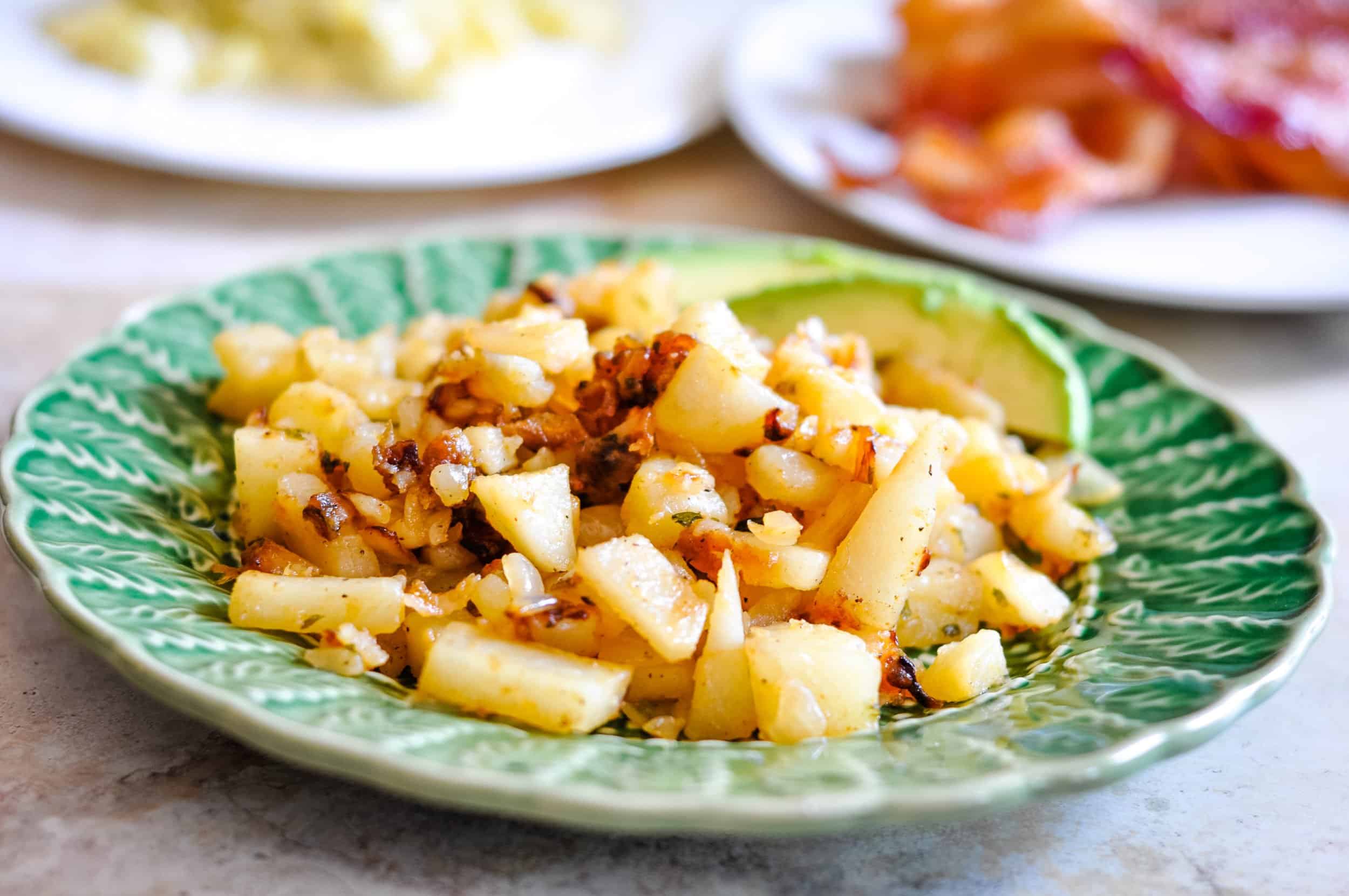 Simple home pan fried potatoes in a small dish.