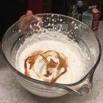 adding maple syrup to whipped cream
