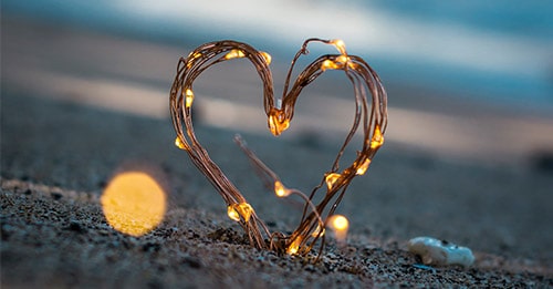 glowing heart in the sand