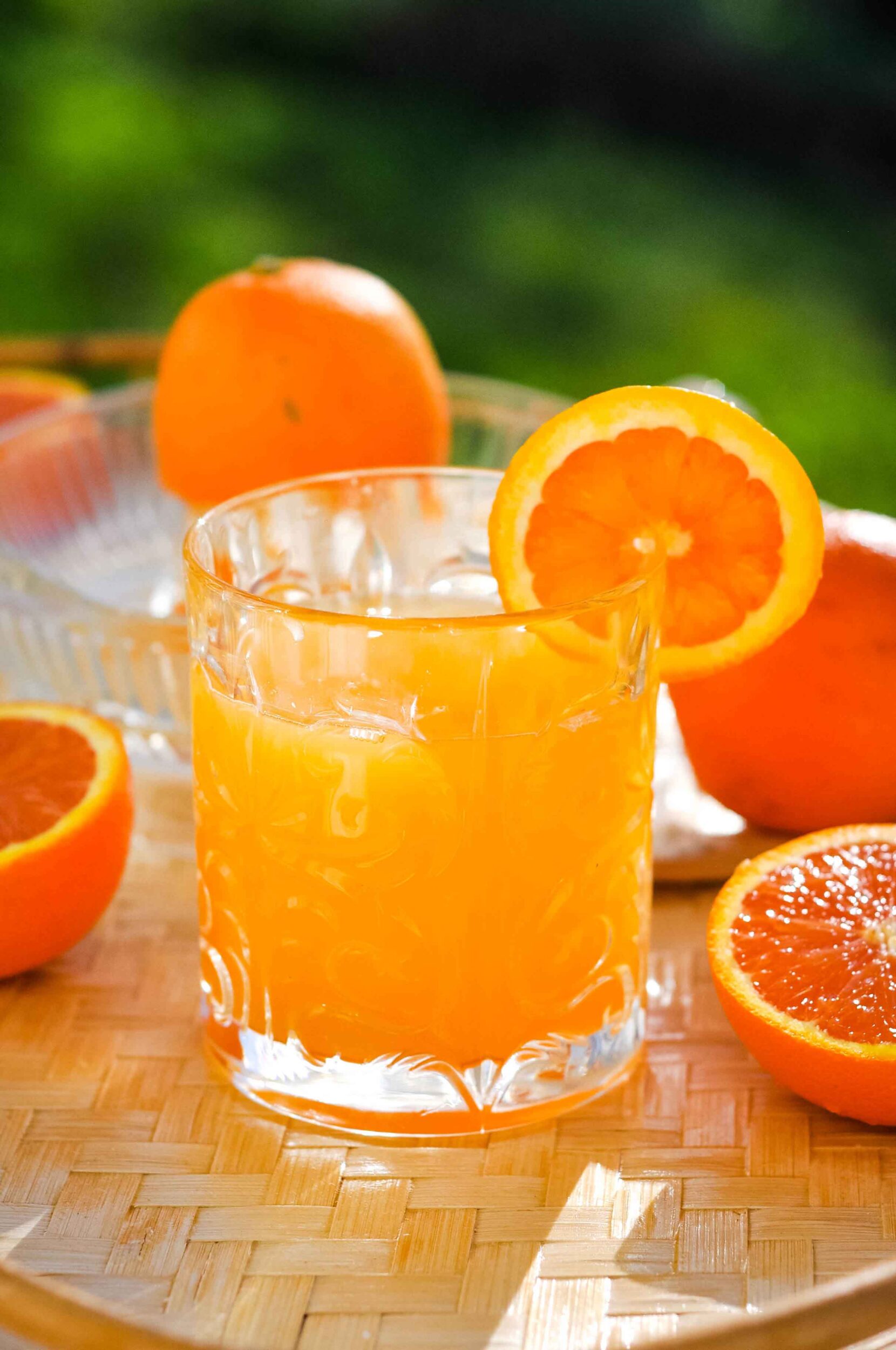 Adrenal cocktail surrounded by oranges.