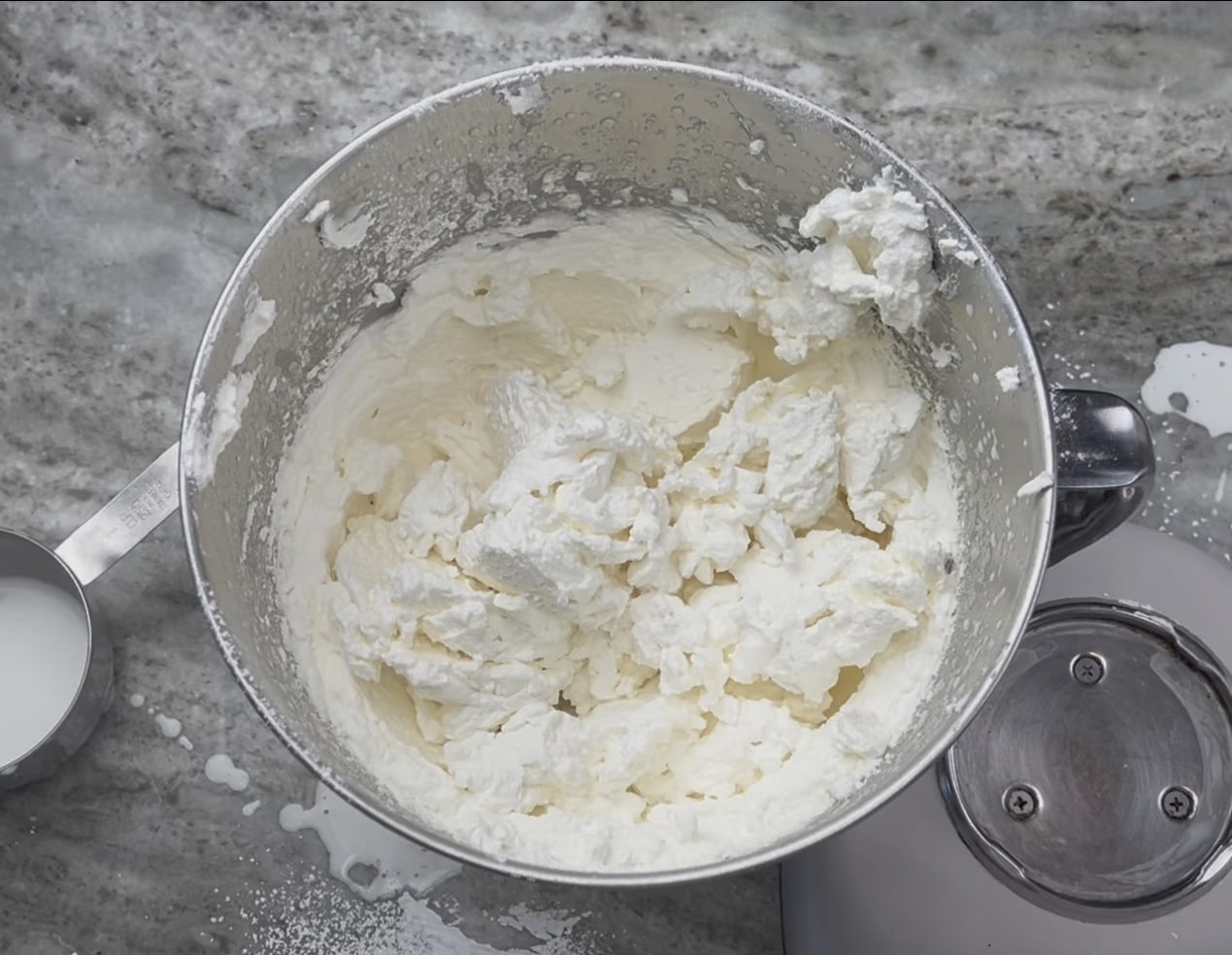 Whipped cream in a mixing bowl.