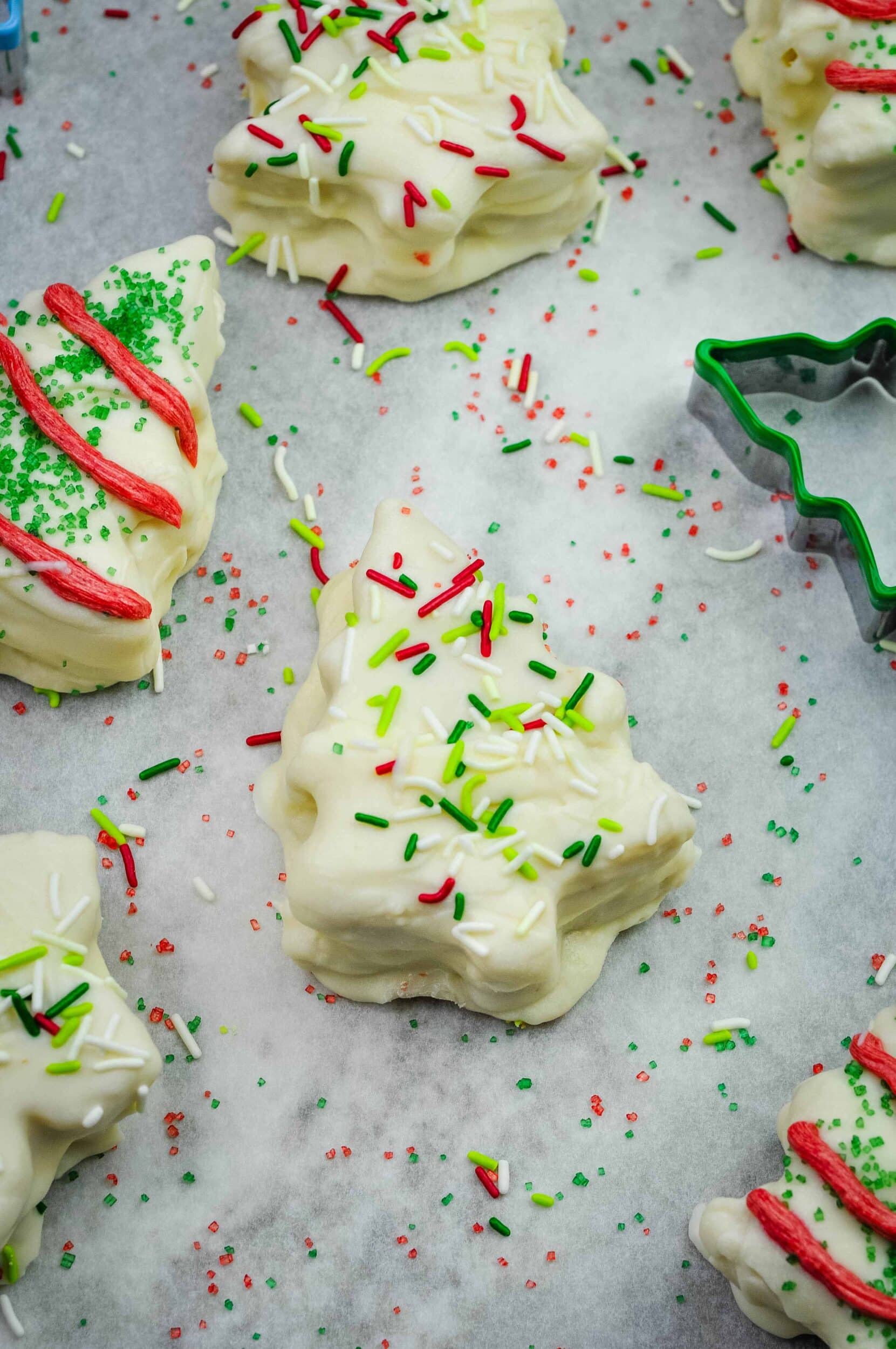 Close up of a Little Debbie copycat Christmas tree cake with lots of red and green sprinkles.