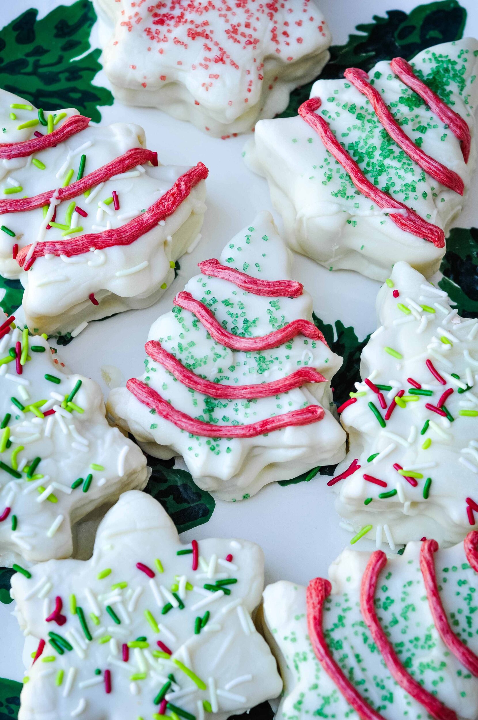 Christmas tree cakes on a red and green platter.