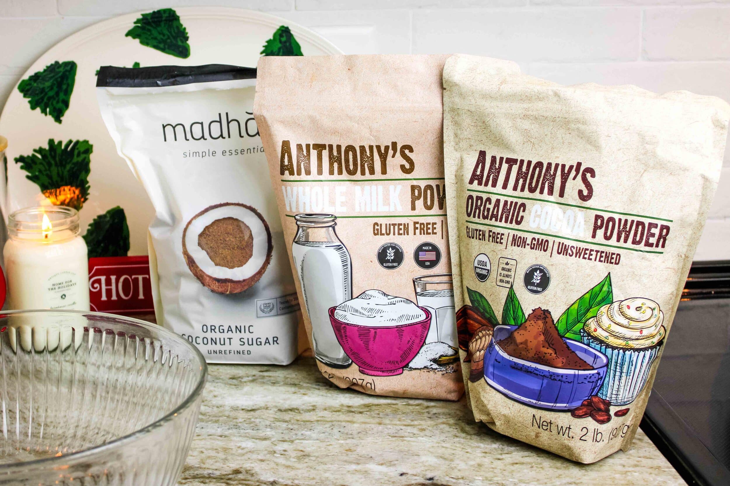 Cocoa mix ingredients lined up: coconut sugar, whole milk powder, and cocoa powder.