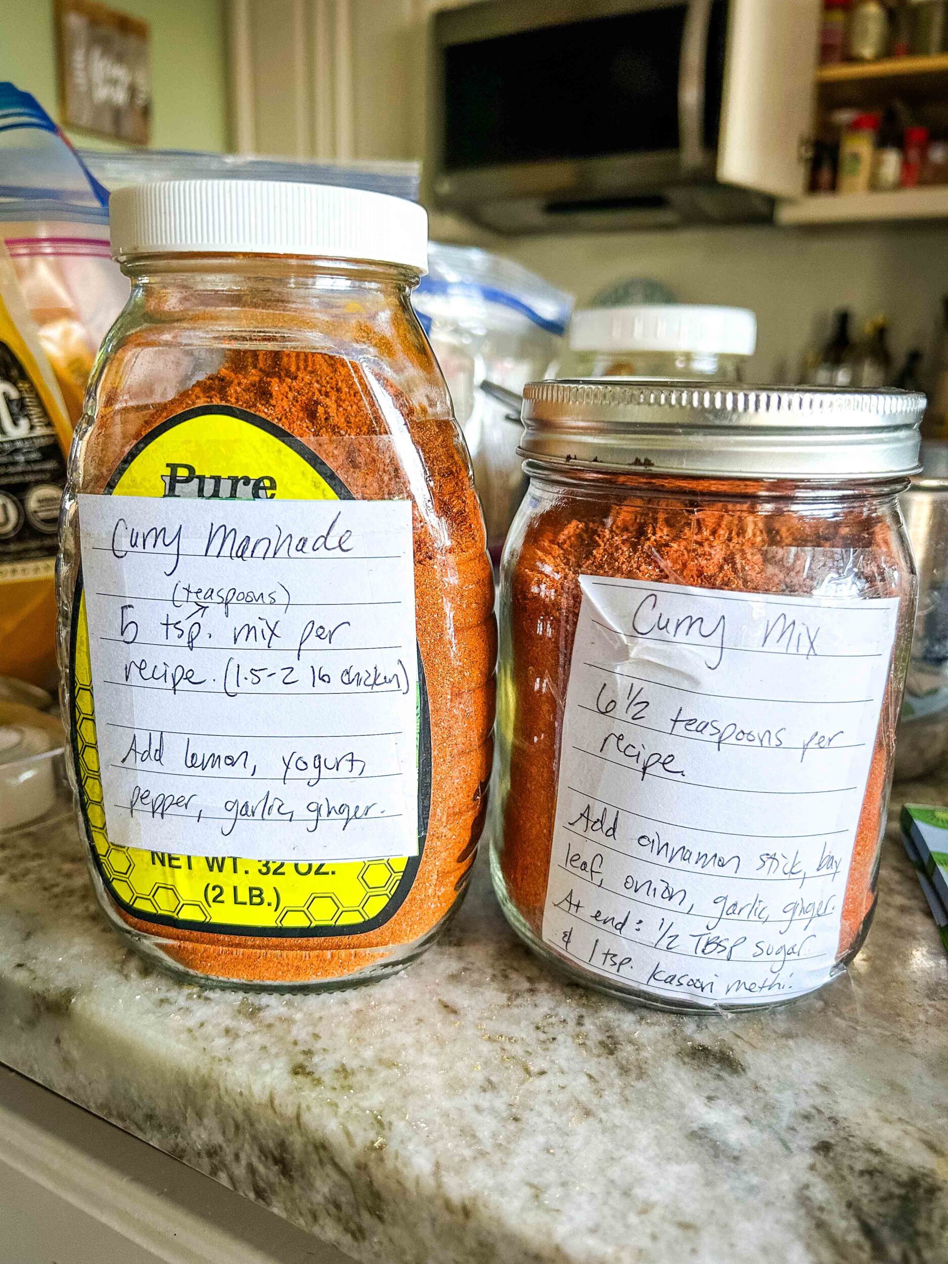 Butter chicken spice mixes in jars with labels.
